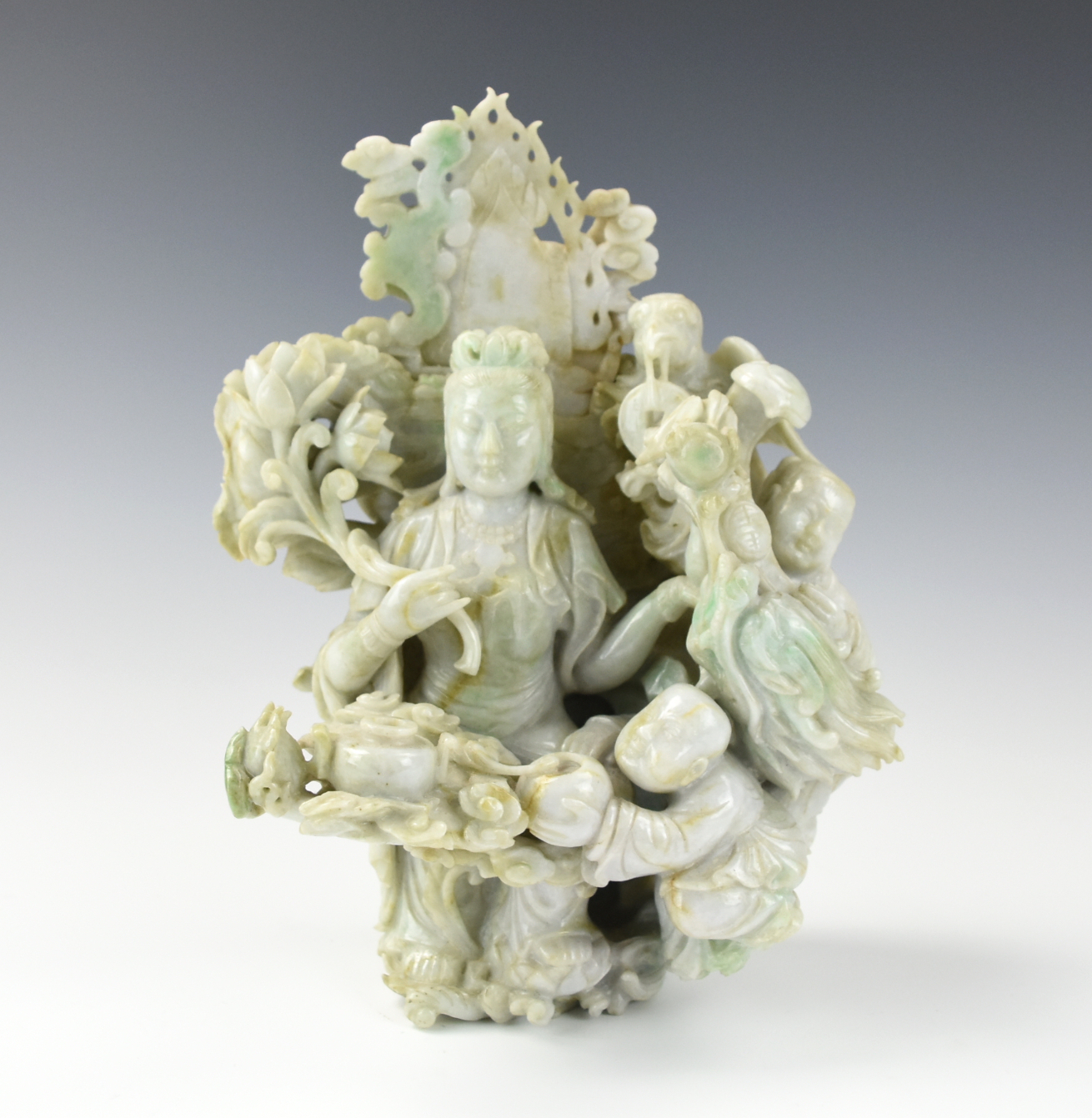 Appraisal: CHINESE JADEITE GUANYIN AND CHILDREN ORNAMENTS Comprising of a jadeite