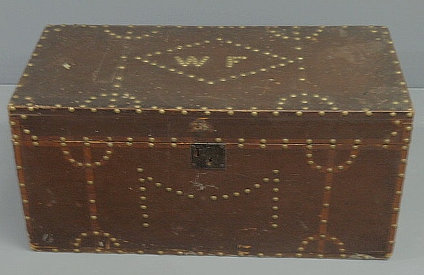 Appraisal: Brass studded storage chest with brown paint decoration and initials