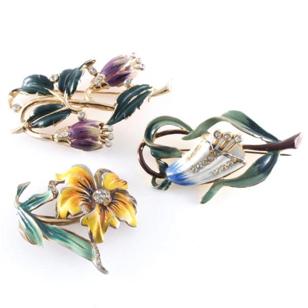 Appraisal: THREE S FLOWER PINS TWO CORO WITH ENAMEL AND DIAMANTE