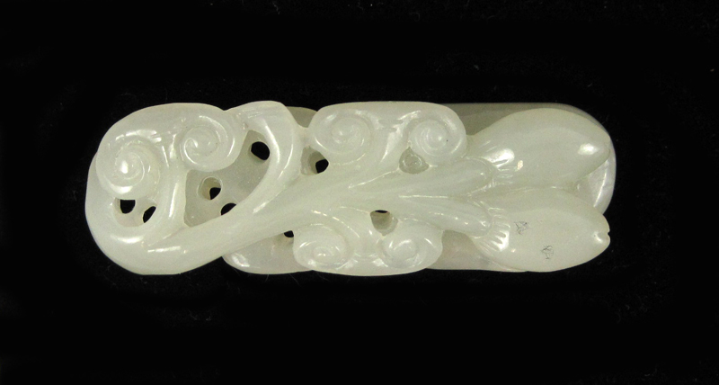 Appraisal: CHINESE CARVED WHITE JADE TOGGLE one side having peach branches