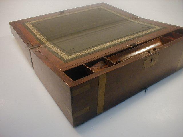 Appraisal: A thC walnut writing box with brass banding and corners