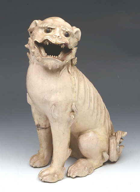 Appraisal: AN ANTIQUE CHINESE CREAM GLAZED DOG OF FO seated with