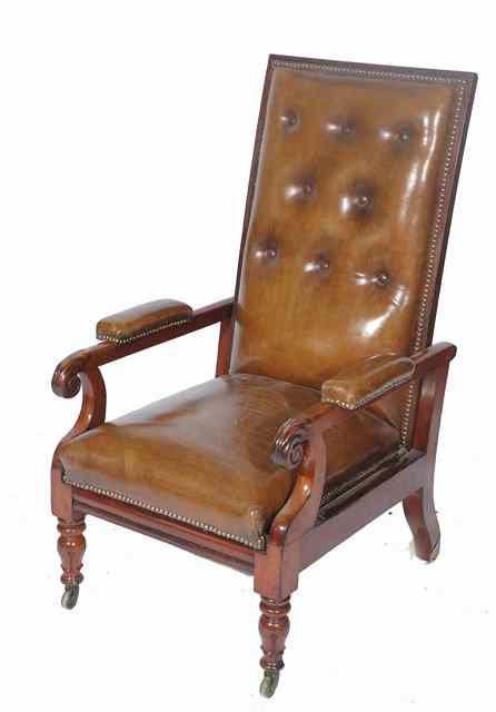 Appraisal: A TH CENTURY MAHOGANY LEATHER UPHOLSTERED LIBRARY ARMCHAIR with a