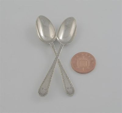 Appraisal: A pair of bright-cut snuff spoons initialled 'DR' by Stephen