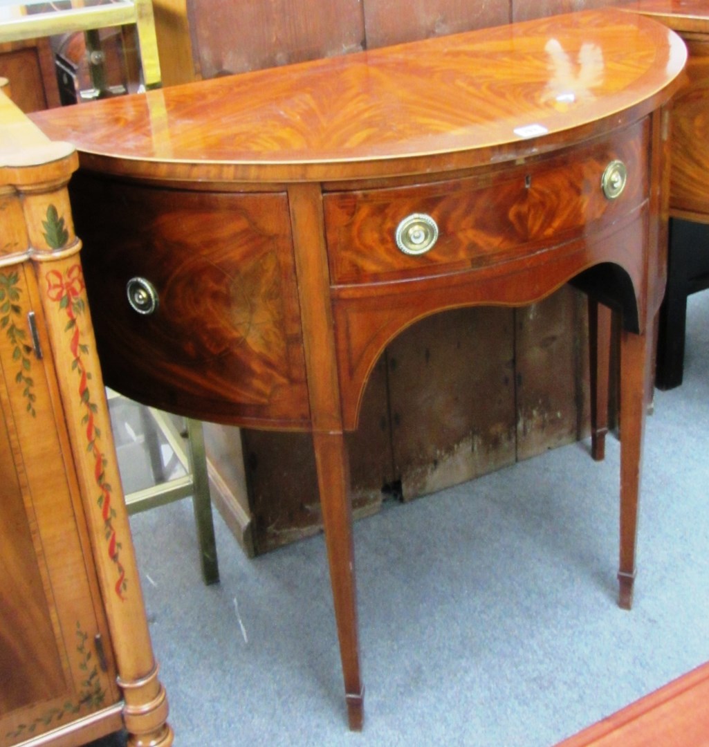 Appraisal: A pair of flame mahogany bowfront sideboards c each with