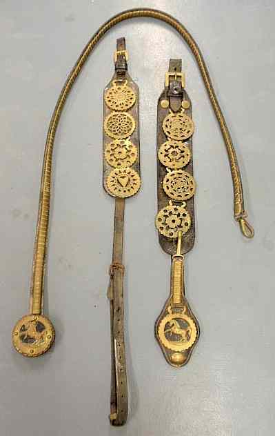 Appraisal: Group of three sections leather and brass harness parts with