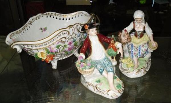 Appraisal: A Dresden reticulated basket and a pair of porcelain figures