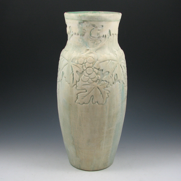 Appraisal: Tall Owens matte vase with grapevine motif A beige matte