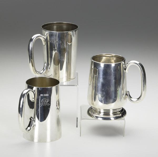 Appraisal: THREE ENGLISH SILVER PINT MUGS Walker Hall Sheffield sterling Perry