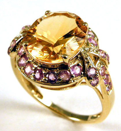 Appraisal: CITRINE AND TEN KARAT GOLD RING centering an oval shaped