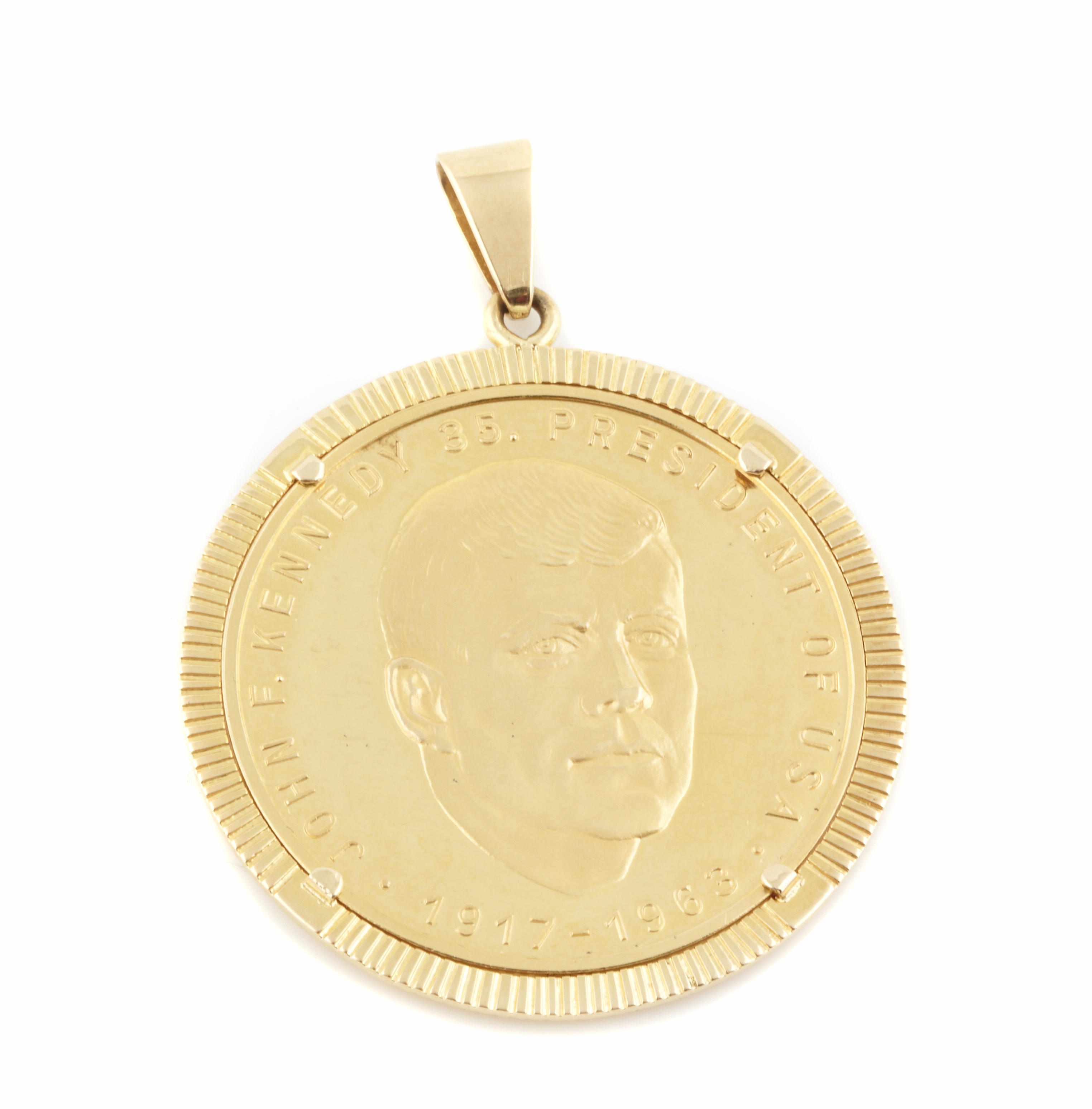 Appraisal: A Kennedy commemorative gold coin and k gold pendant g