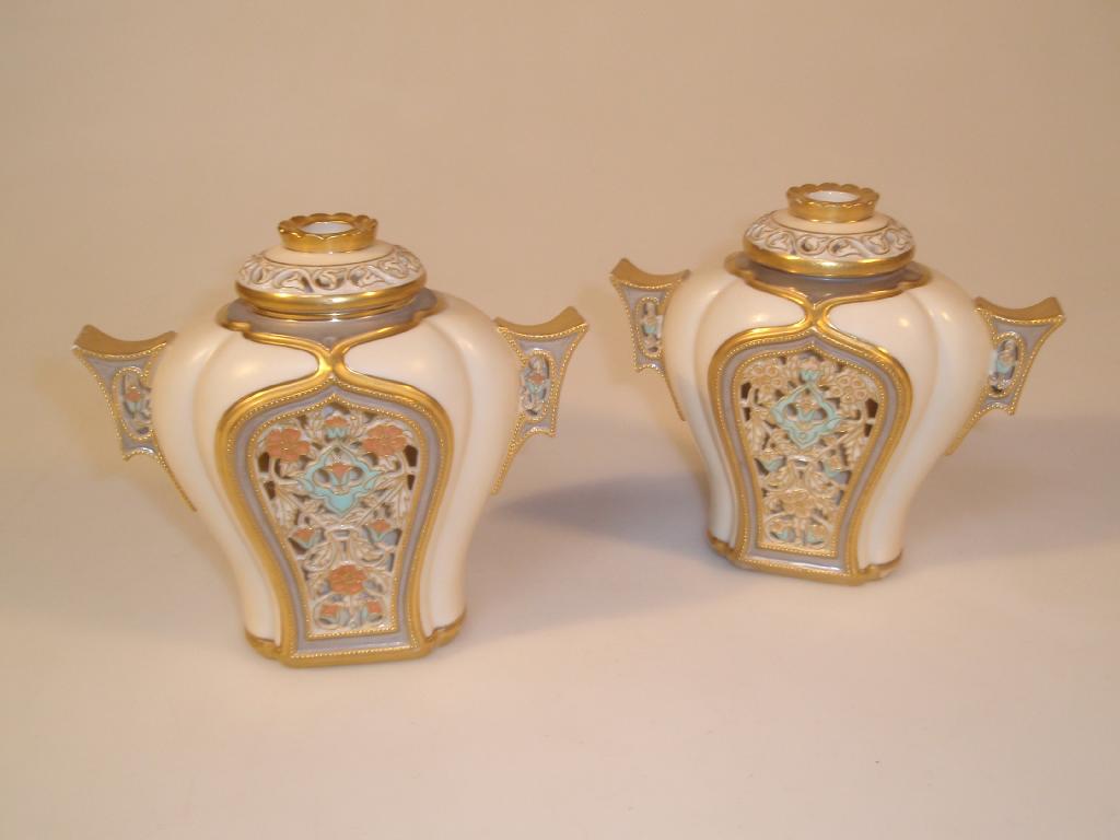 Appraisal: A pair of Royal Worcester pomander vases and covers of