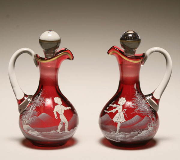 Appraisal: Pair of Victorian Mary Gregory cranberry glass decanters with enameled