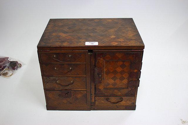 Appraisal: A TH CENTURY JAPANESE PARQUETRY ADJUSTABLE TABLE CABINET with stained