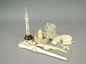 Appraisal: A collection of th century carved ivory items including a