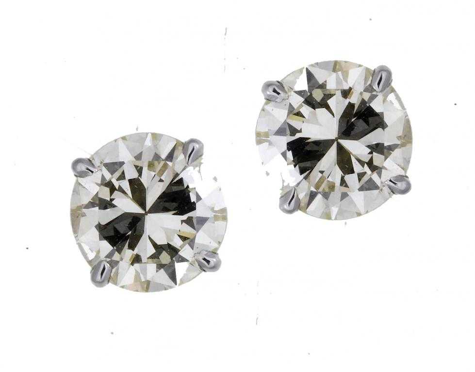 Appraisal: A PAIR OF DIAMOND EAR STUDS each set with a