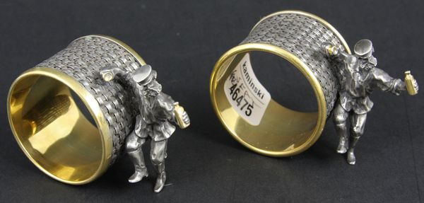 Appraisal: Pair of silver napkin rings with attached figures marked and