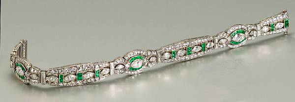 Appraisal: An art deco diamond emerald and platinum bracelet Oscar Heyman