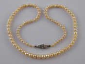 Appraisal: A graduated cultured pearl necklace pearls between approx - mm