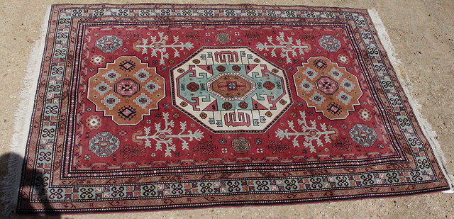 Appraisal: A MID TH CENTURY MIDDLE EASTERN RED AND GREEN GROUND