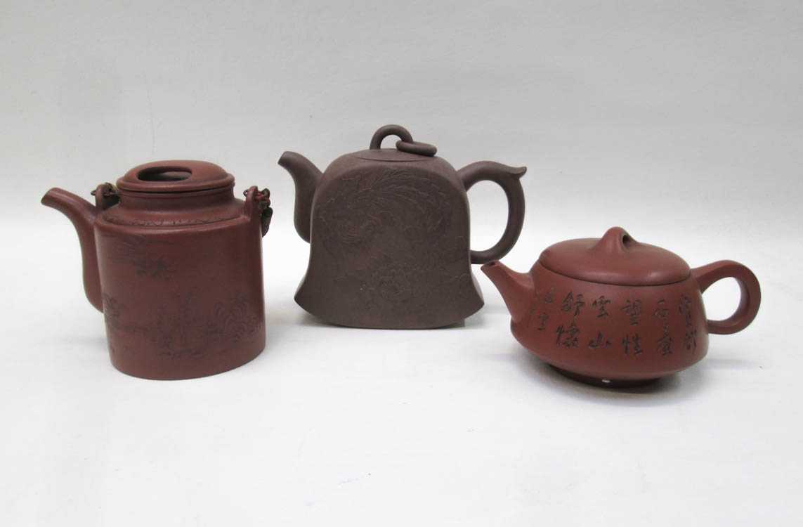 Appraisal: THREE ZISHA TEAPOTS of various forms and motifs each with