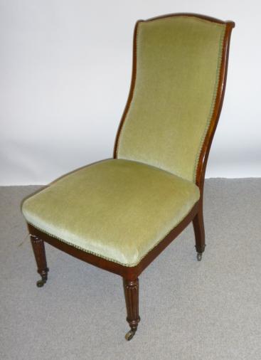 Appraisal: AN EARLY VICTORIAN MAHOGANY NURSING CHAIR upholstered in pale green