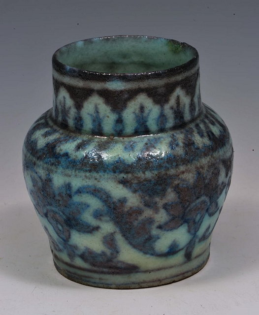 Appraisal: A SMALL PERSIAN TURQUOISE VASE with leaf decoration cm high