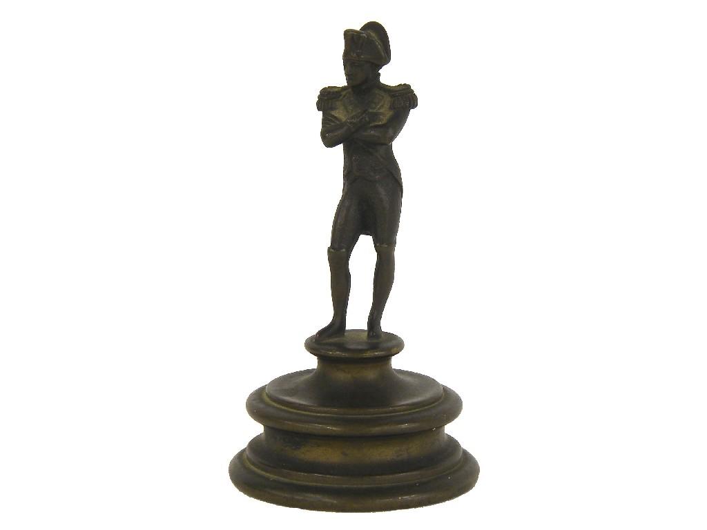 Appraisal: Miniature bronze figure of a standing naval officer upon a