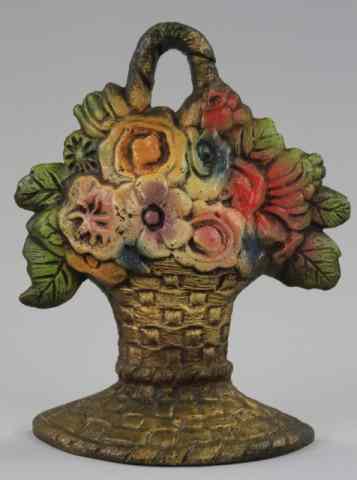 Appraisal: FLOWER BASKET DOORSTOP Cast iron depicts floral bunch in gold