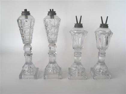 Appraisal: Two pairs of uncolored pressed glass fluid lamps boston and