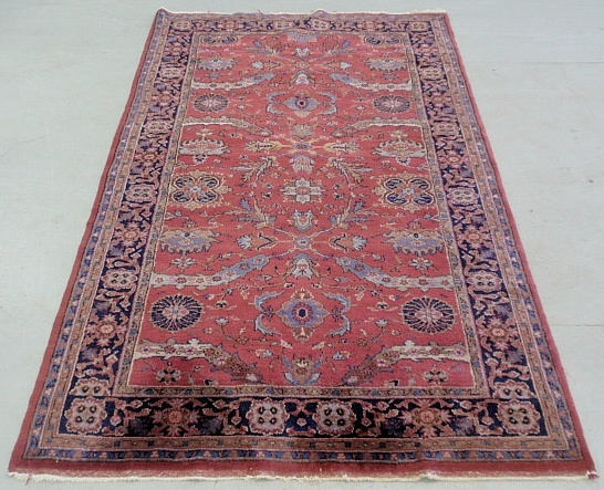 Appraisal: - Large Sarouk oriental center hall carpet with red field