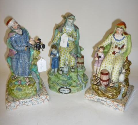 Appraisal: A PAIR OF PEARLWARE FIGURES late th century of Elijah