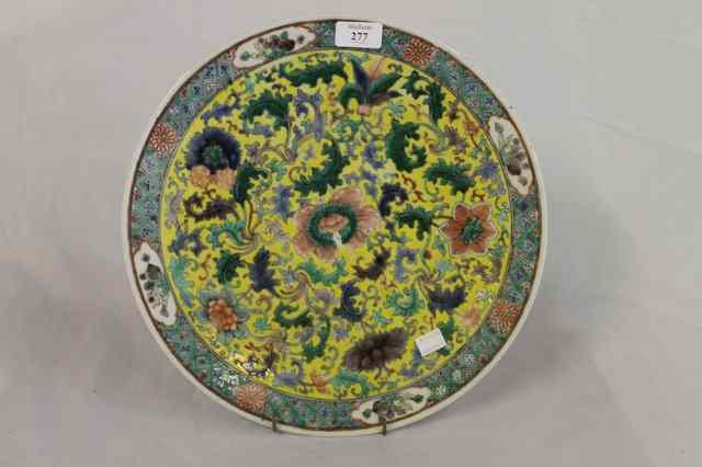 Appraisal: A CHINESE YELLOW GROUND CIRCULAR CHARGER with allover trailing foliage