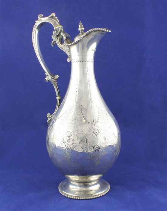 Appraisal: A Victorian silver pear shaped hot water jug engraved with