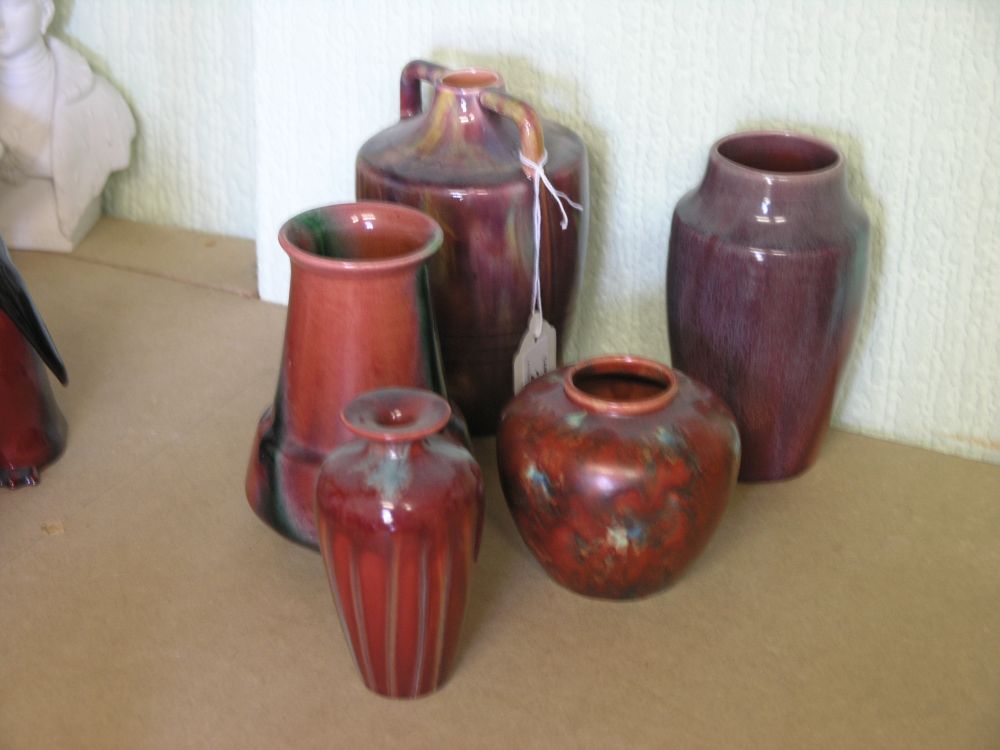 Appraisal: Five early th century Art Pottery vases glazed in crimson