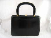 Appraisal: A black leather suede lined handbag x cm