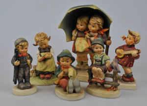 Appraisal: Six Goebel Hummel figures - boy and girl under umbrella