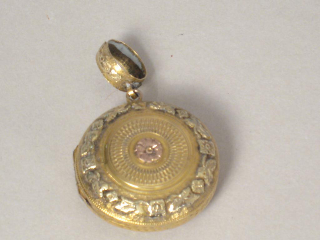 Appraisal: A th Century two colour gold circular Pendant Vinaigrette with