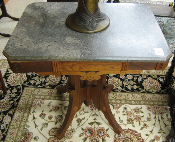 Appraisal: A VICTORIAN MARBLE-TOP LAMP TABLE Eastlake design American c having