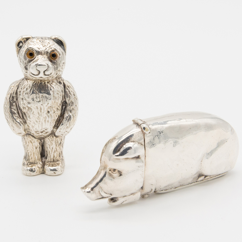 Appraisal: TWO ENGLISH SILVER ANIMAL FORM VESTA CASES Comprising A teddy