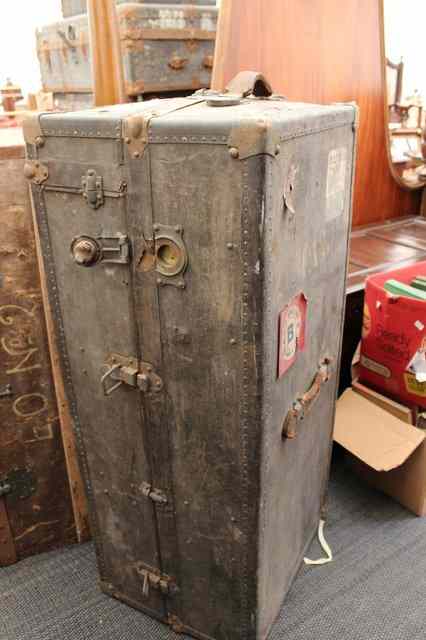 Appraisal: A PAIR OF EARLY TH CENTURY WARDROBE TRUNKS each opening