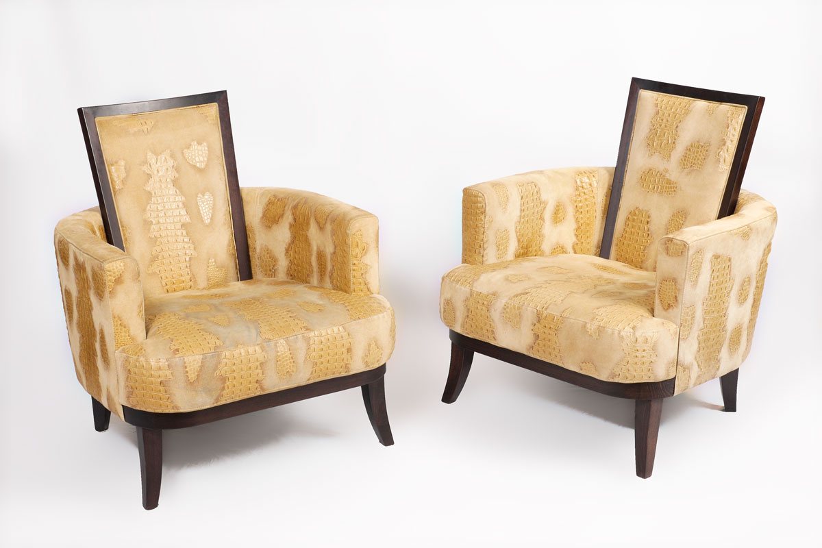 Appraisal: PAIR MODERN FAUX CROCODILE LOUNGE CHAIRS Barrel back with raised