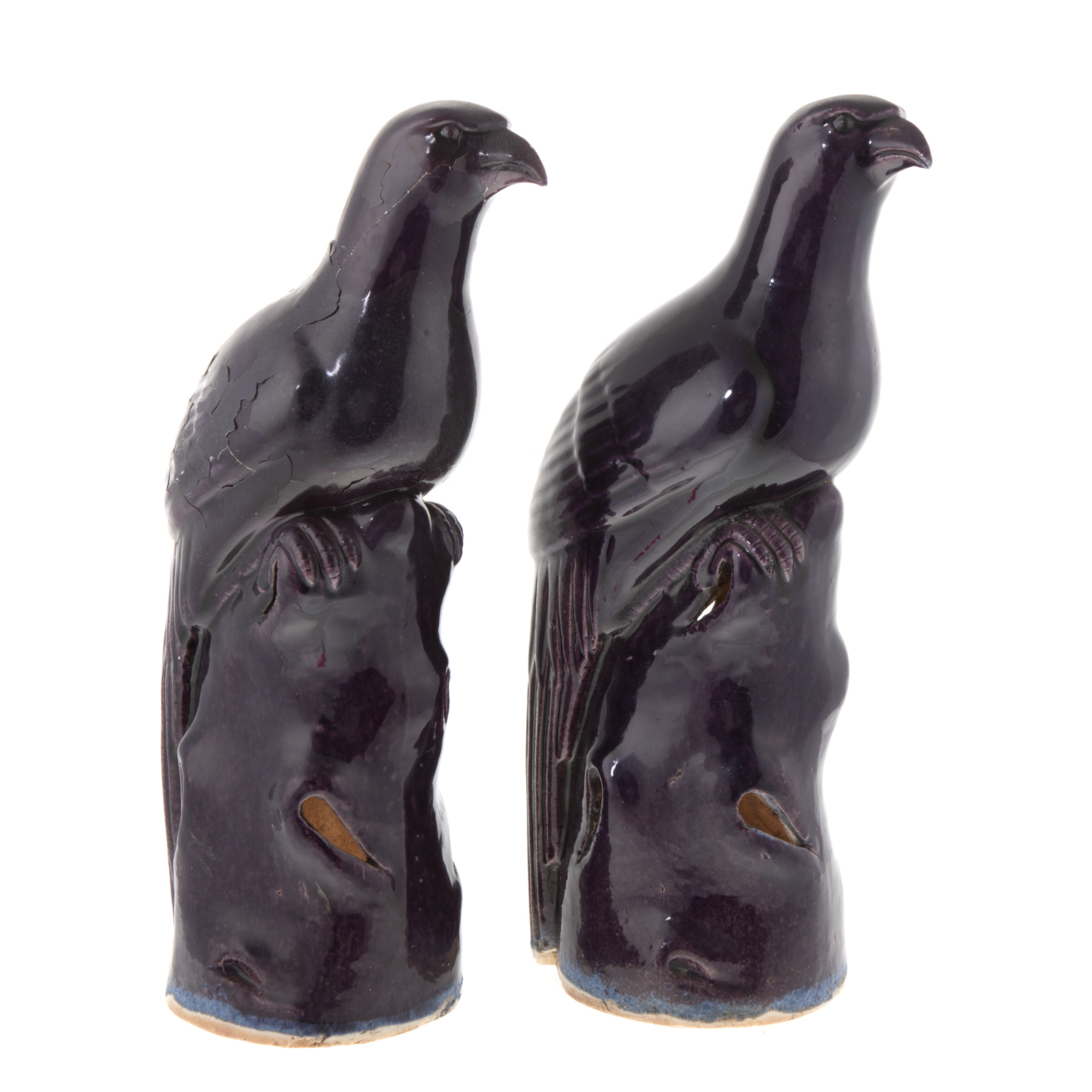 Appraisal: A PAIR CHINESE AUBERGINE MONOCHROME PORCELAIN FALCONS Modeled as falcon