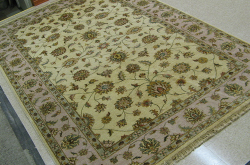 Appraisal: PAKISTANI KASHAN CARPET overall scrolling floral arabesque design on ivory