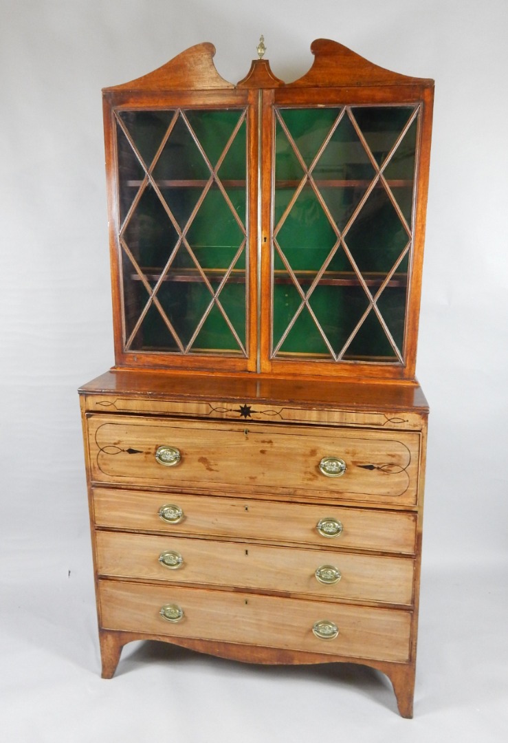 Appraisal: A George III and later mahogany secretaire bookcase the top