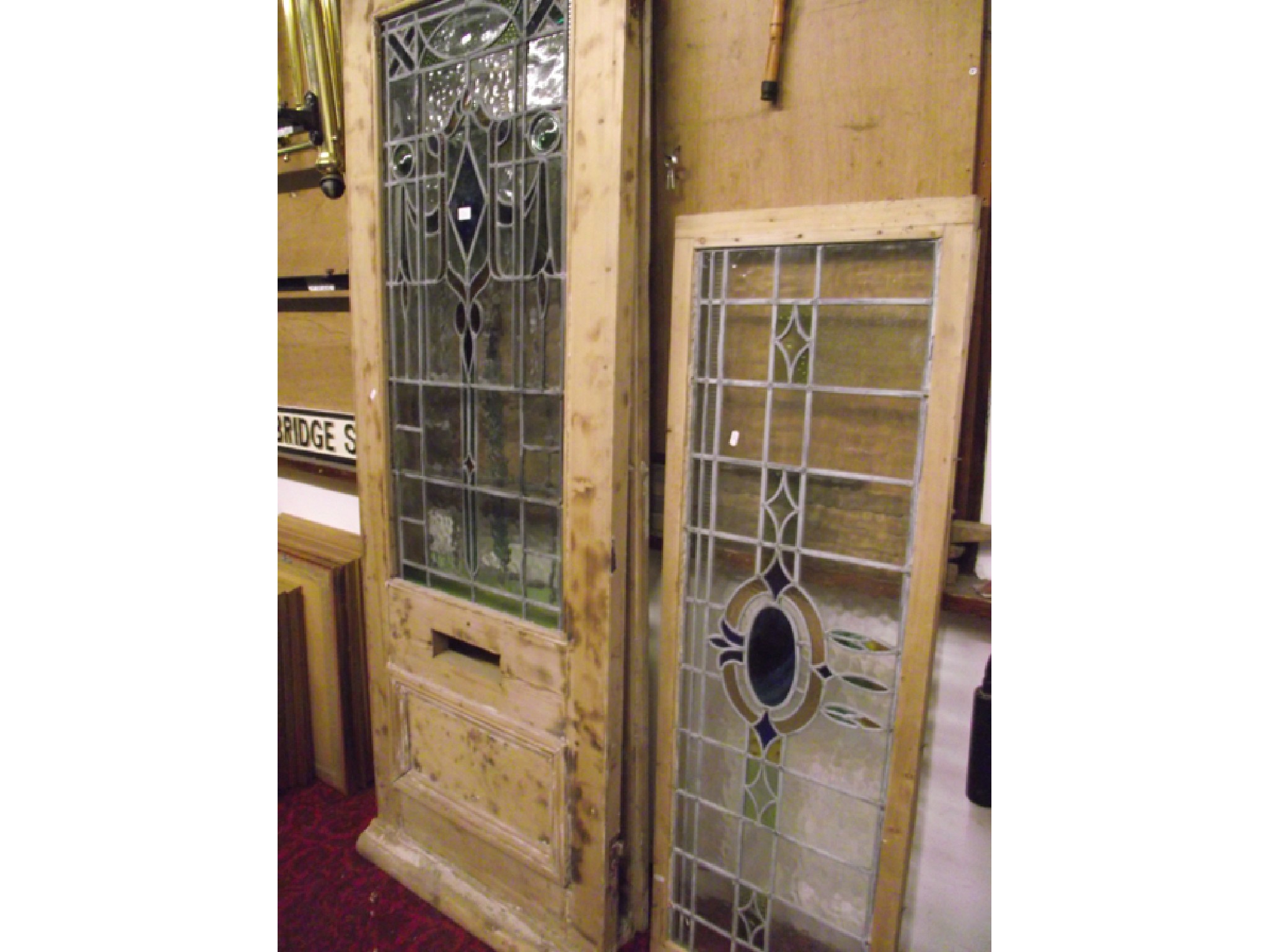 Appraisal: A pair of reclaimed stripped pine framed doors with lower