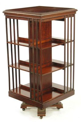 Appraisal: A late Victorian mahogany revolving bookstand with embossed brass trade