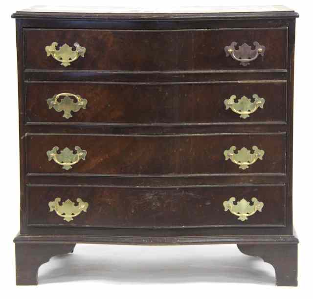 Appraisal: A reproduction serpentine chest of four long drawers cm wide