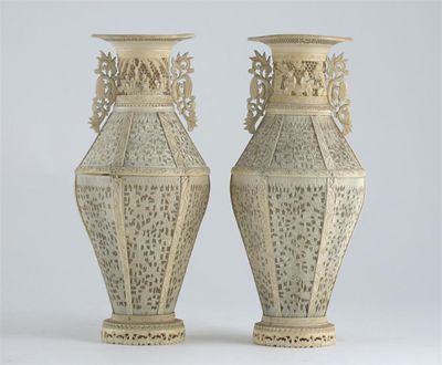 Appraisal: A pair of Chinese ivory vases formed of panels carved