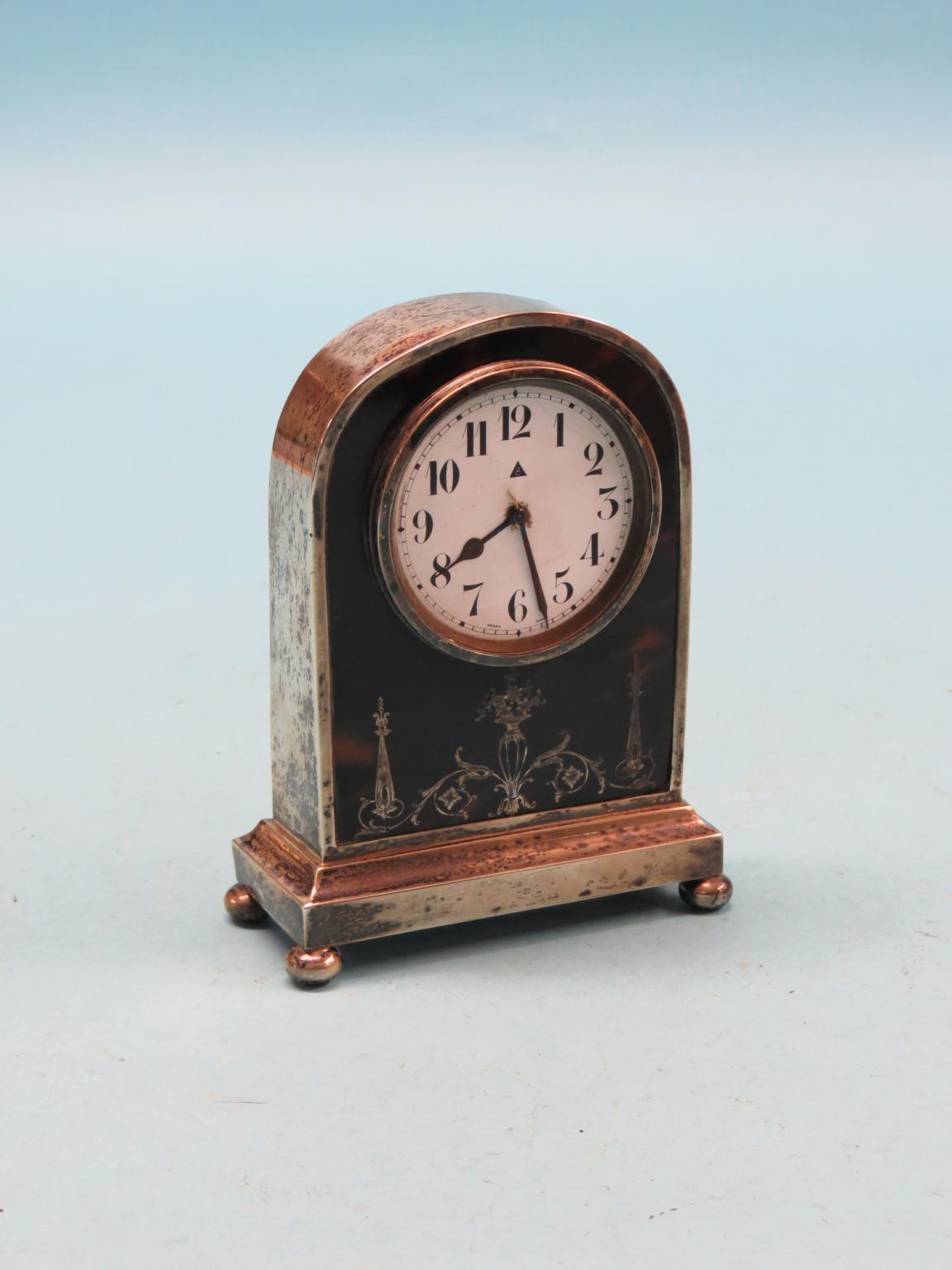 Appraisal: An early th century silver and tortoiseshell mantel clock circular